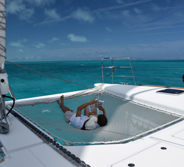 Relaxing on private catamaran day charter